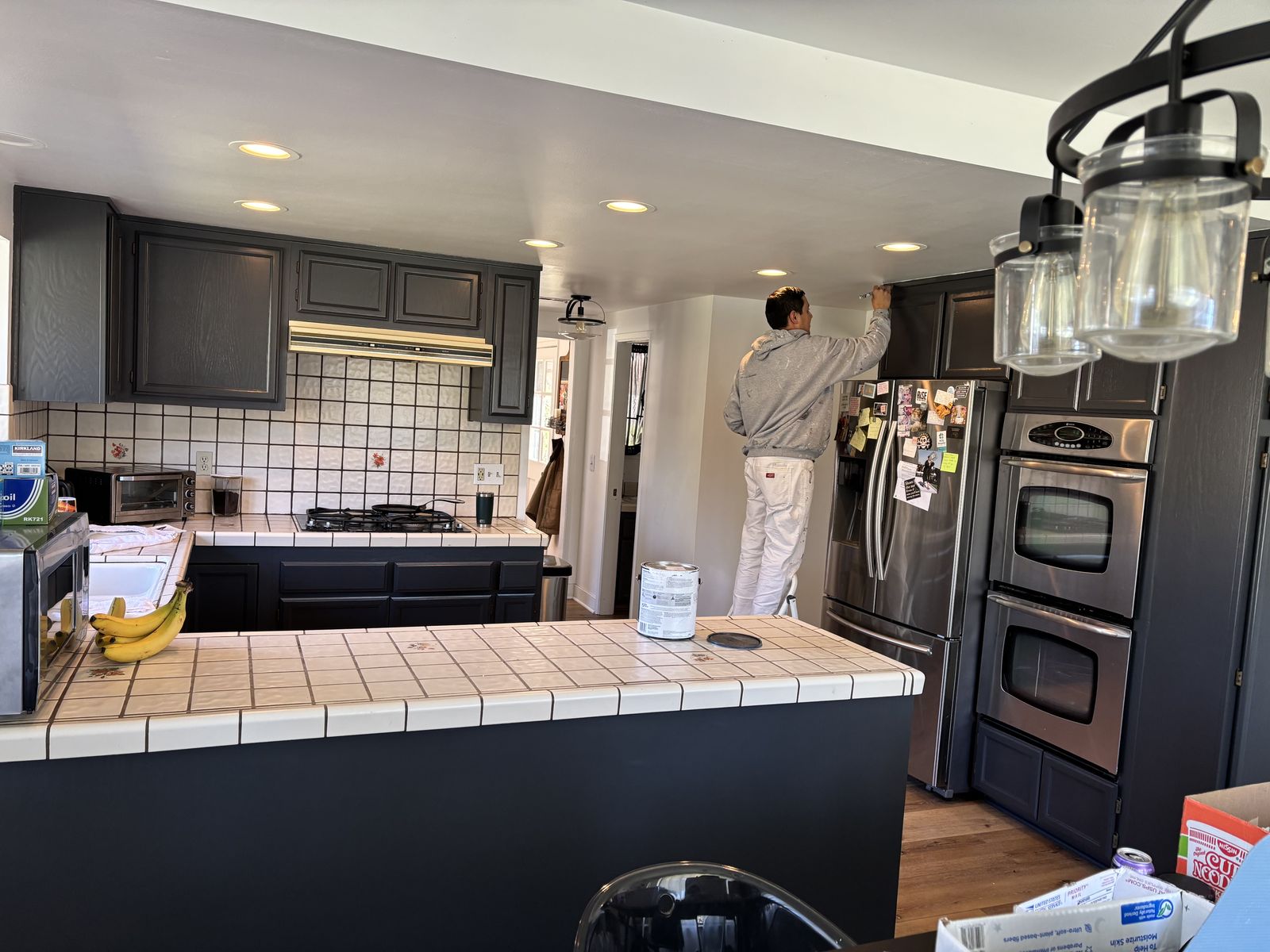 Kitchen cabinets being refinished a dark charcoal, work in progress, in Santa Ynez, CA
