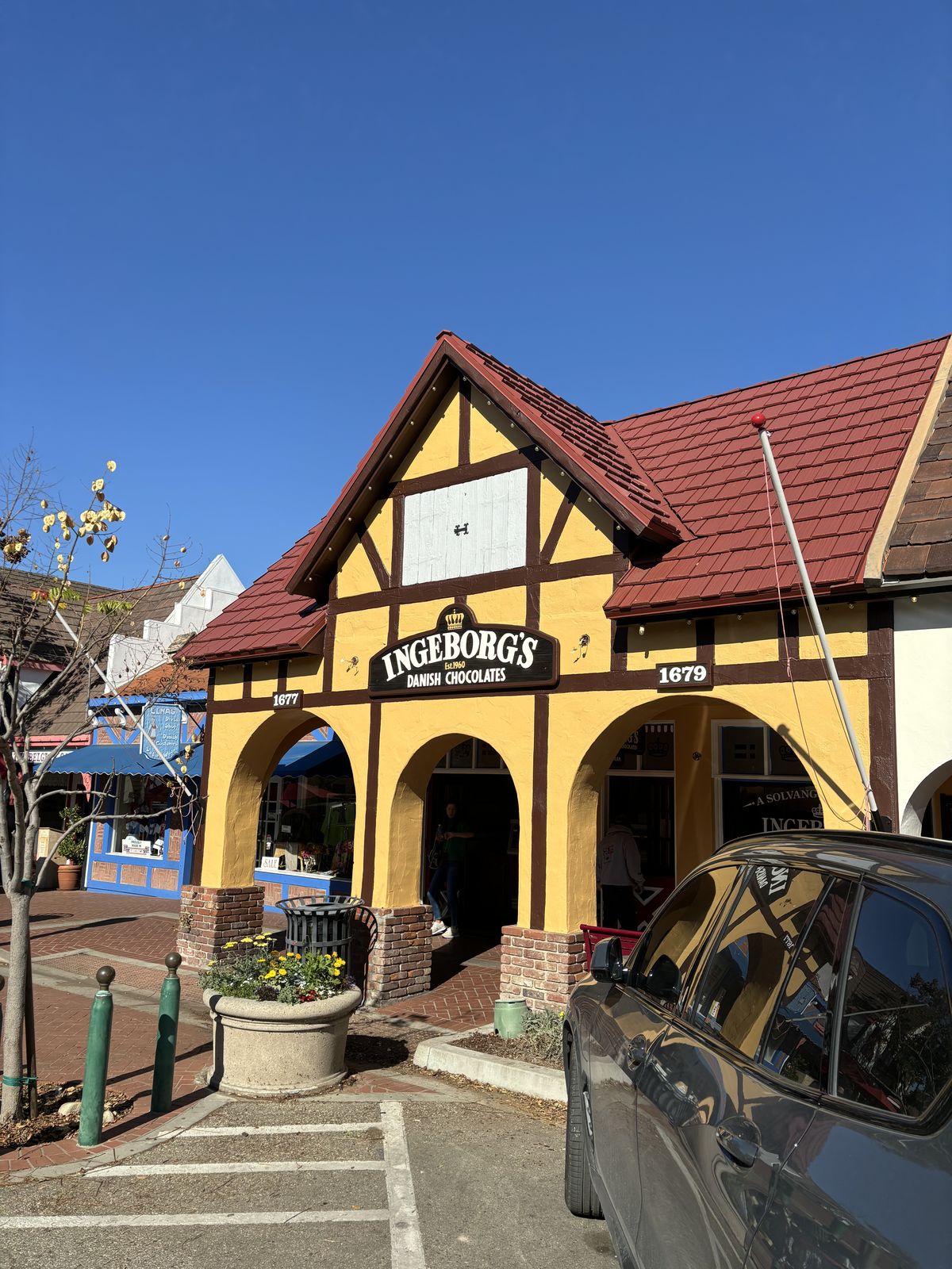 Freshly painted yellow stucco commercial storefront in Solvang, CA